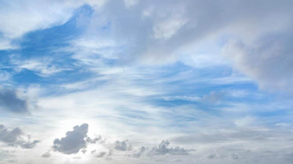 Tranquil blue and white cloudscape above Kapaa with light soft clouds.