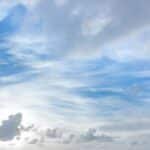 Tranquil blue and white cloudscape above Kapaa with light soft clouds.