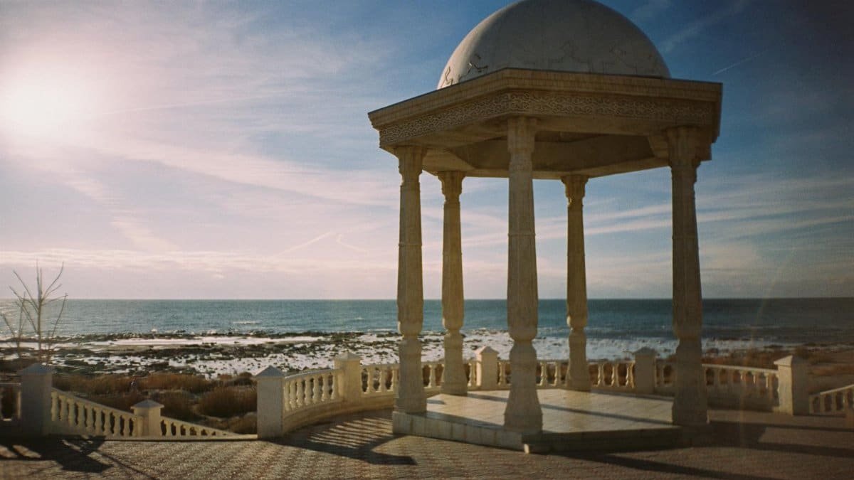 Beautiful gazebo overlooking the Caspian Sea, capturing serene Akatu coastal architecture under a vibrant sky.