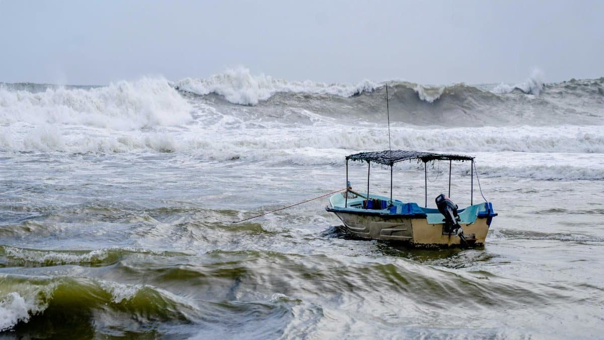 A small boat tethered and struggling amidst rough waves in the ocean, suggesting stormy weather.