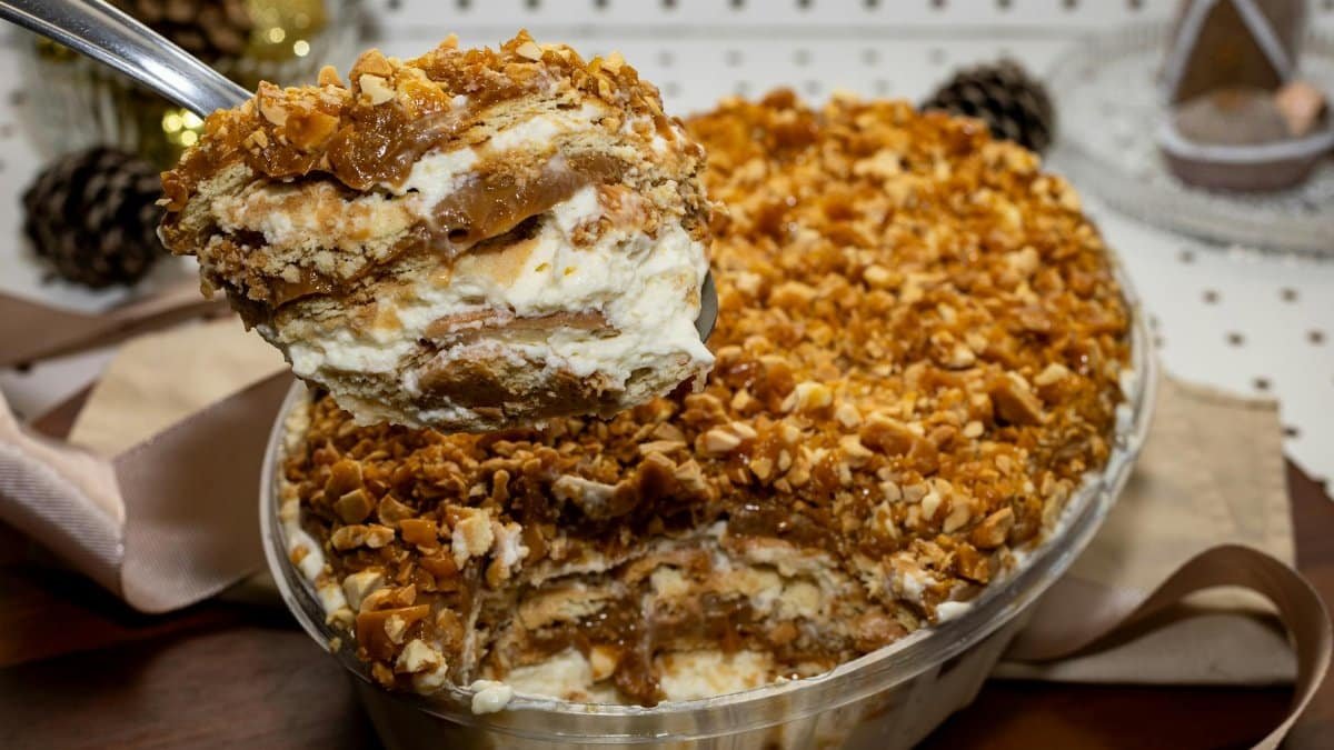 Indulgent dessert with layers of cream, caramel, and crunchy nuts, perfect for festive occasions.