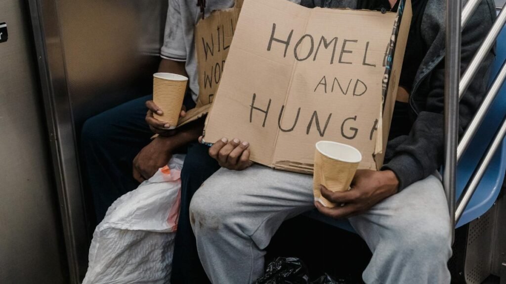 A poignant image capturing the realities of homelessness on public transportation.