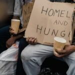 A poignant image capturing the realities of homelessness on public transportation.