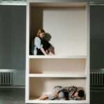 Image depicting people in compartments, symbolizing isolation and anxiety.