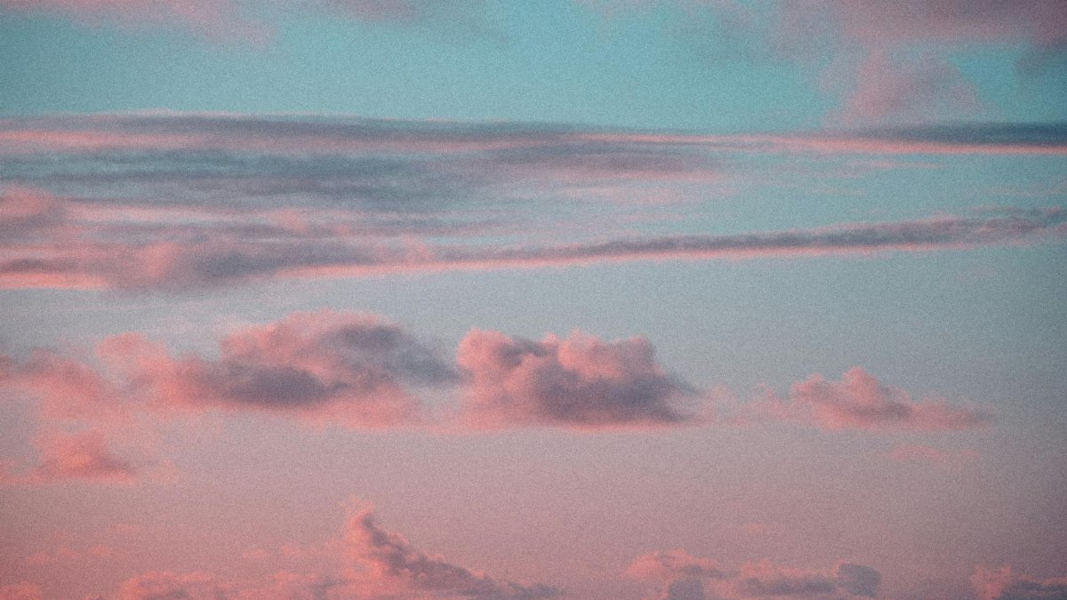 Beautiful pink and blue sky with clouds at sunset in Honolulu, Hawaii.