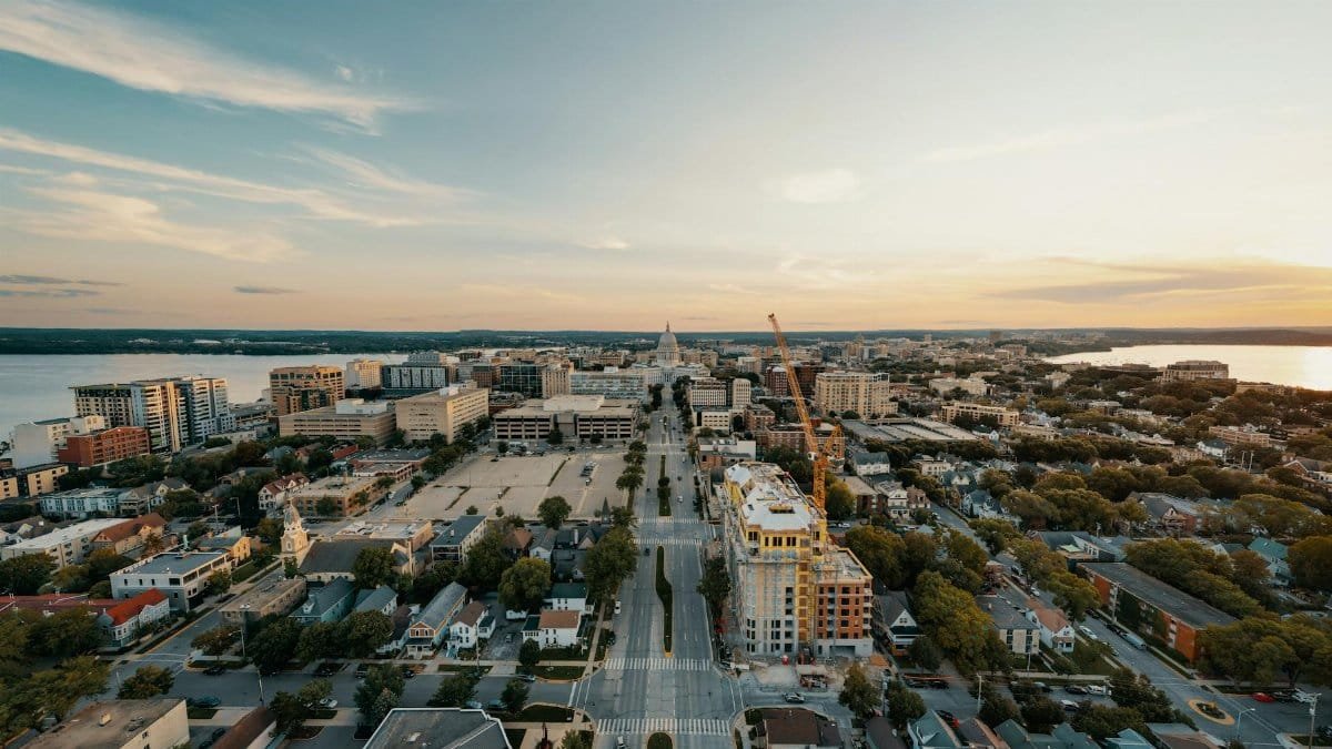Stunning aerial view of Madison, Wisconsin cityscape at sunset with the Capitol building.