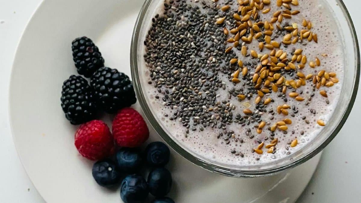 Close-up of a smoothie bowl with chia seeds, flaxseed, and fresh berries, perfect for a wholesome breakfast.