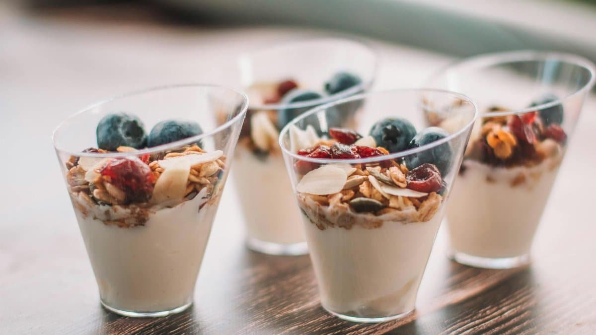 Fresh and delectable yogurt parfaits topped with granola and berries, perfect for a healthy breakfast.