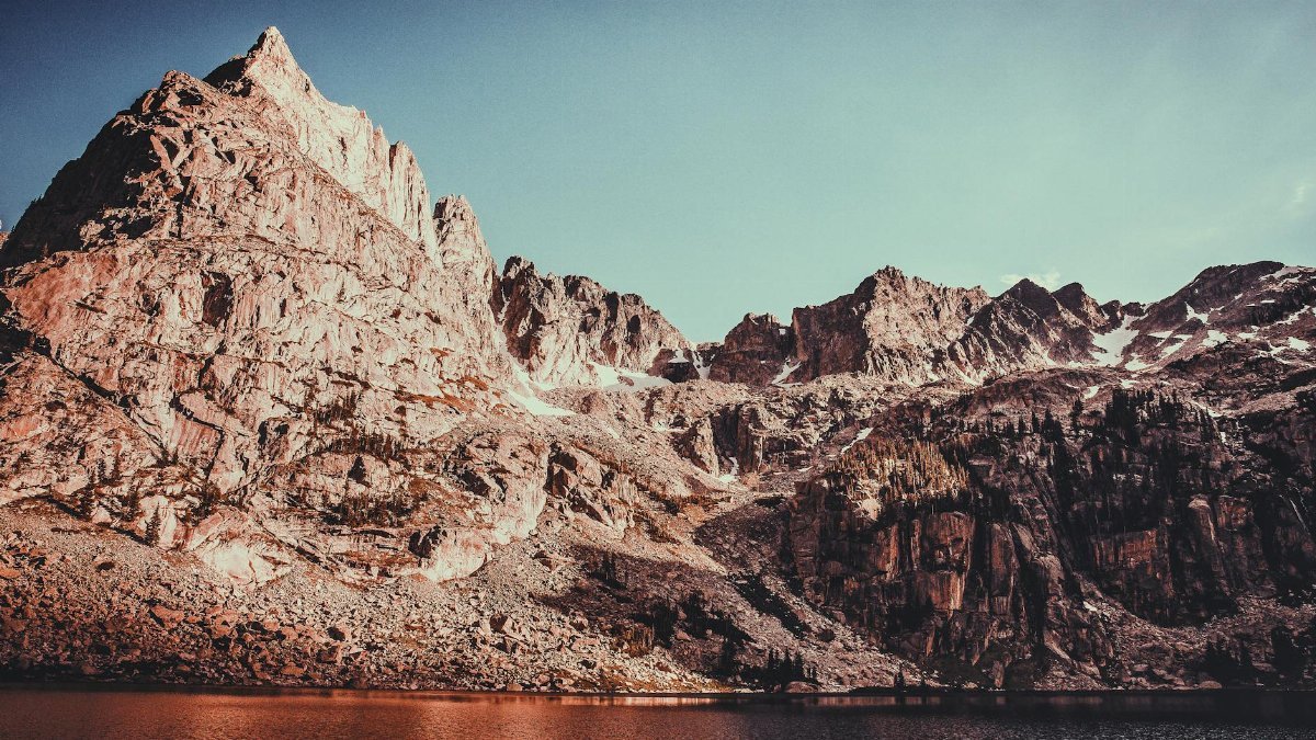 Breathtaking view of the rugged Rocky Mountains against a clear sky in Colorado.