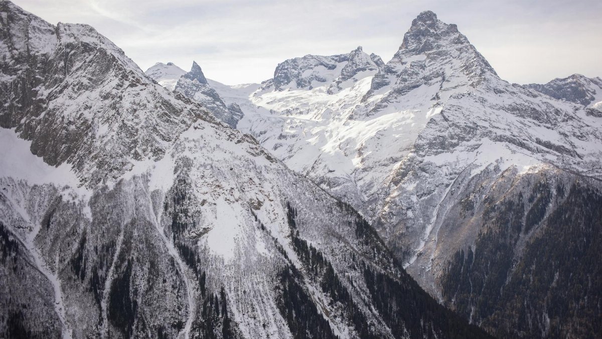 Majestic snowy mountain peaks during winter, showcasing natural beauty and scenery.
