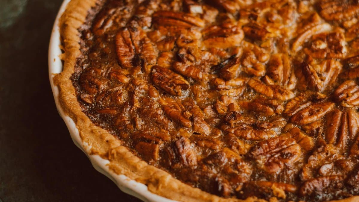 Delicious homemade pecan pie with golden crust captured in a close-up for food lovers.