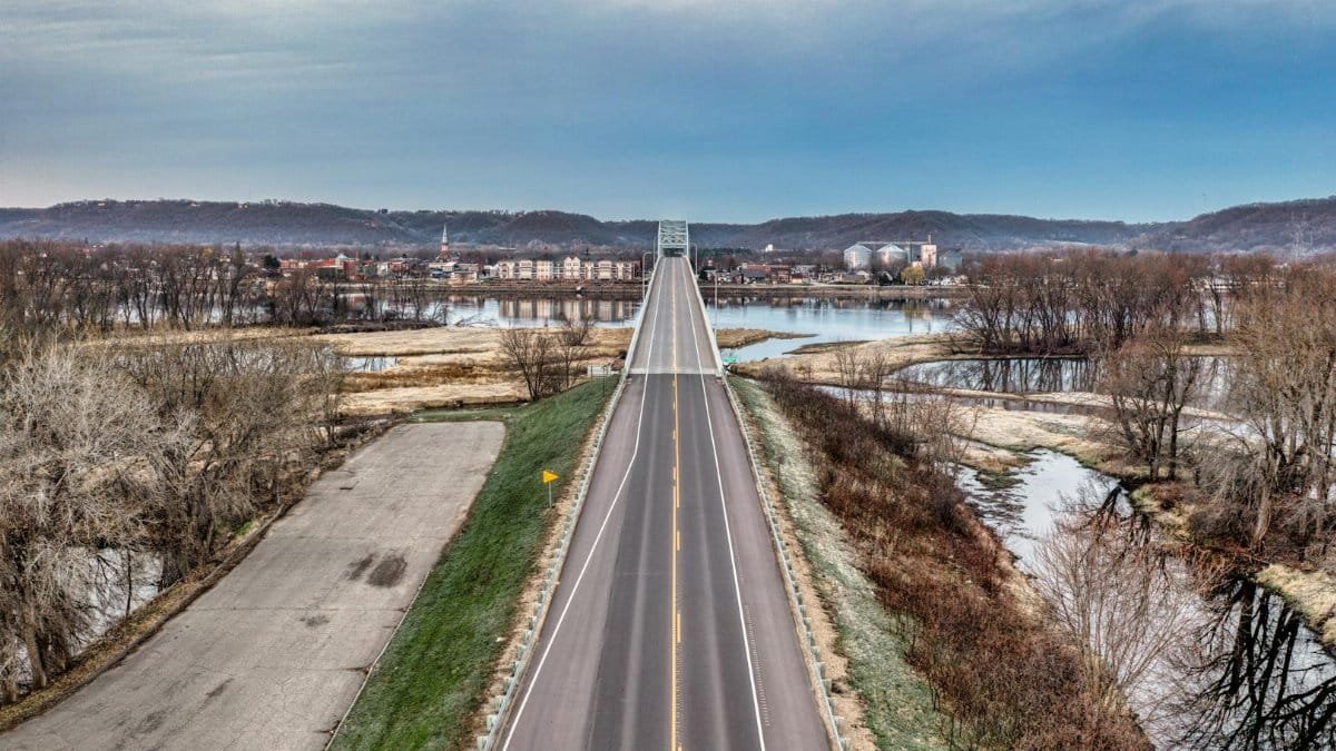 A scenic aerial view of a bridge over the Mississippi River in Wabasha, Minnesota, during winter.