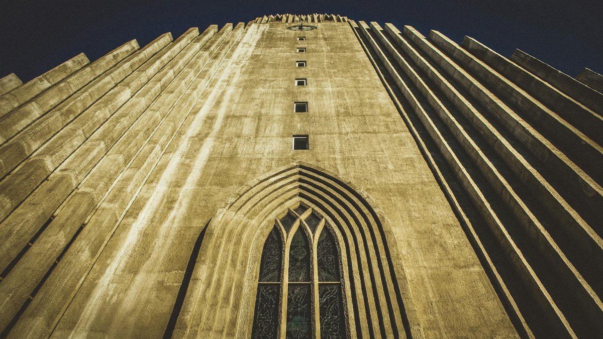 Majestic view of Hallgrímskirkja's facade capturing modern architectural design in Reykjavik, Iceland.