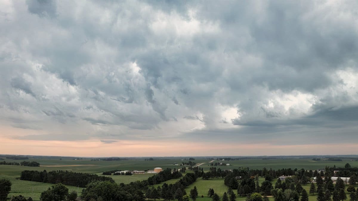 Expansive rural landscape in Plainview, Minnesota under dramatic skies.
