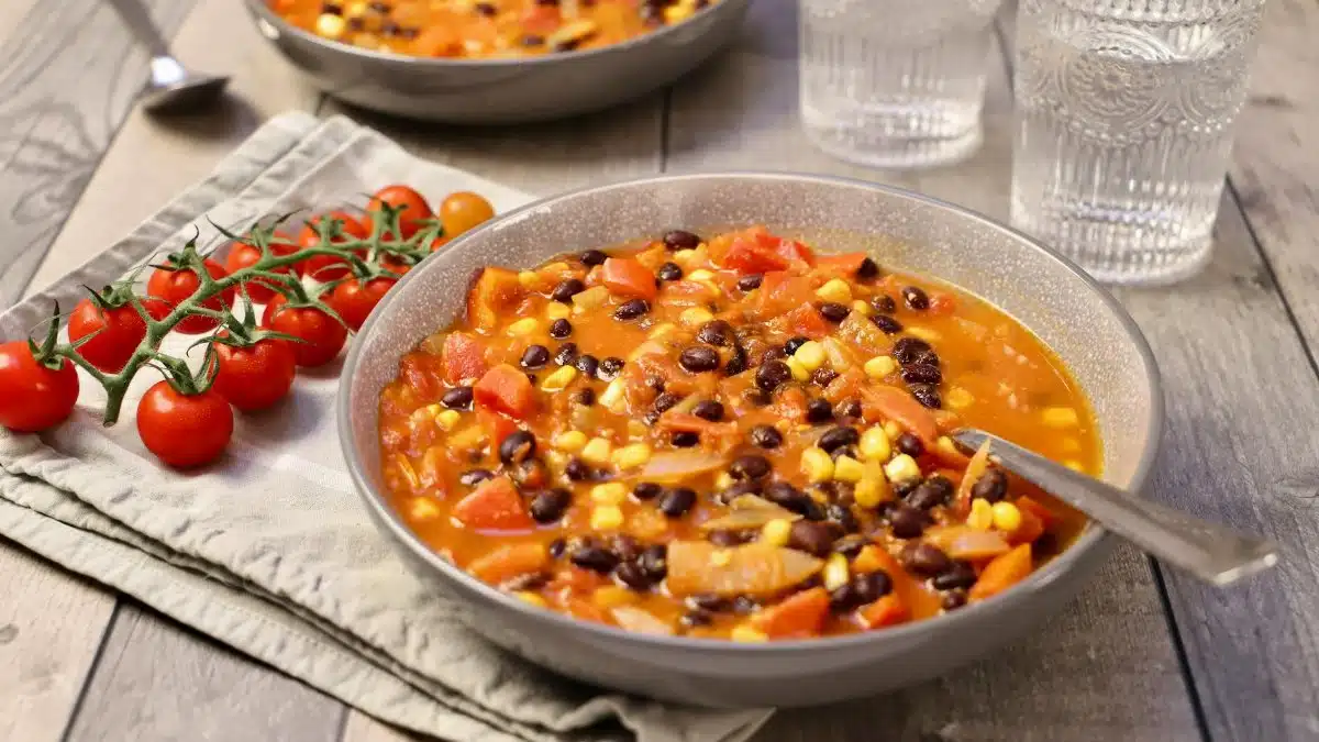 Warm and hearty vegetable bean stew served in rustic bowls, perfect for a cozy meal.
