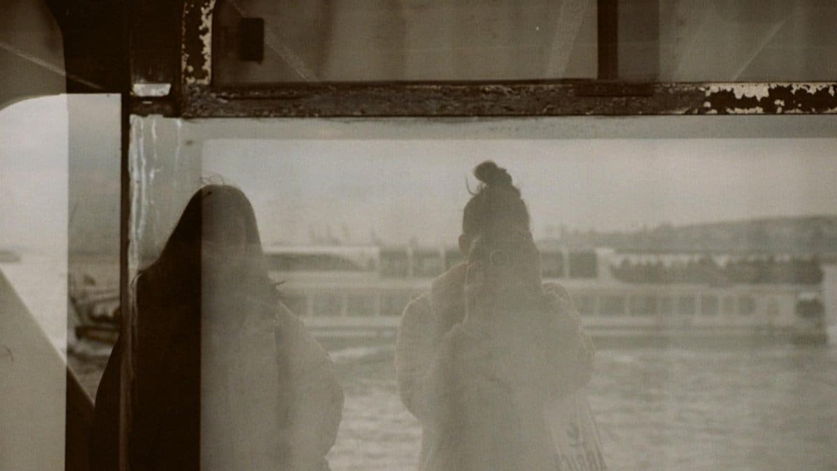 Reflective self-portrait on a ferry in Istanbul, capturing a unique perspective.