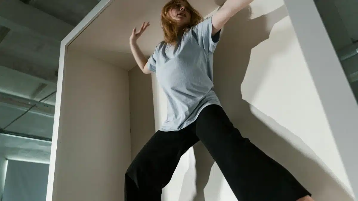 A woman in a confined space depicting anxiety and claustrophobia indoors.