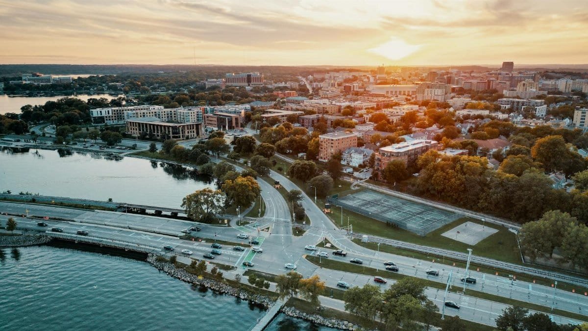Stunning aerial cityscape of Madison, Wisconsin during sunset with waterfront views.