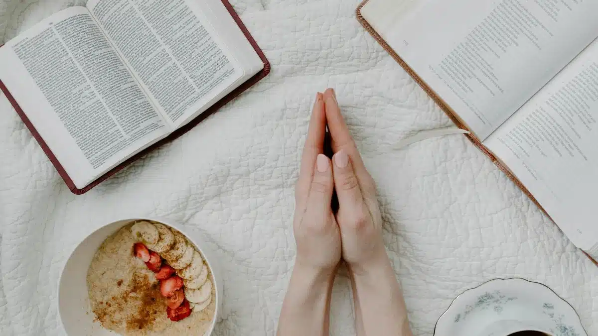 A serene morning scene with a person praying, an open Bible, oatmeal, and coffee.