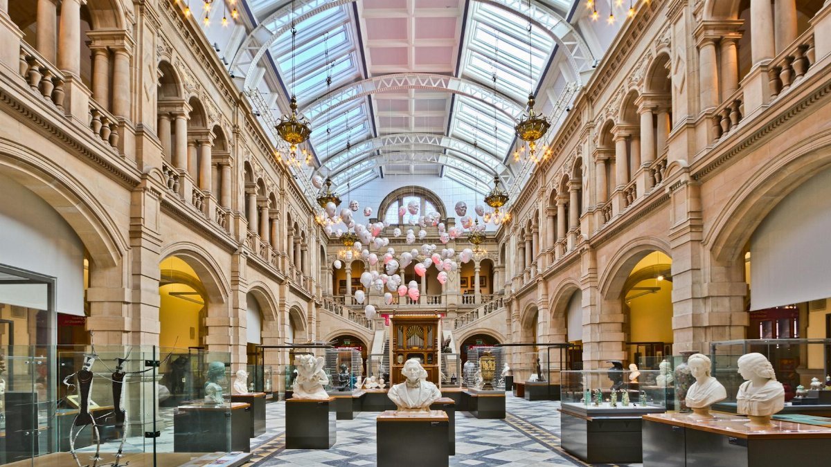 Discover the stunning interior of a Scottish art gallery, showcasing classical sculptures and architectural beauty.