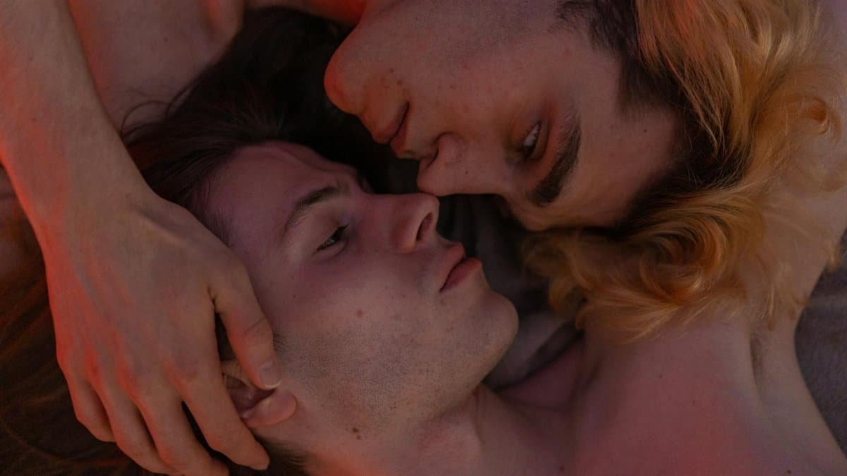 A soft, intimate portrait of a couple in a warm embrace, highlighting love and connection.