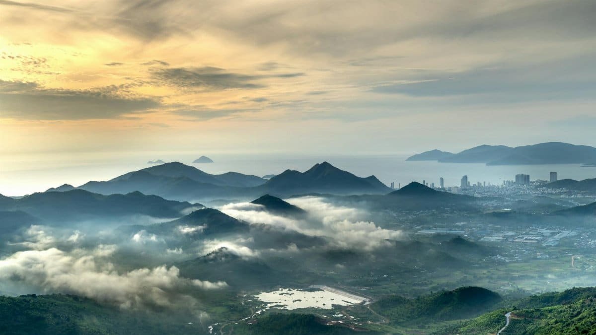 Breathtaking view of a misty mountain valley at sunrise, showcasing nature's beauty.