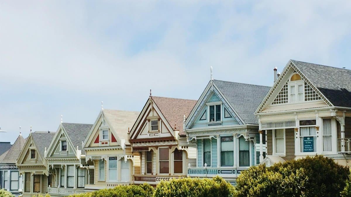 Iconic Painted Ladies Victorian houses in San Francisco with clear blue skies.