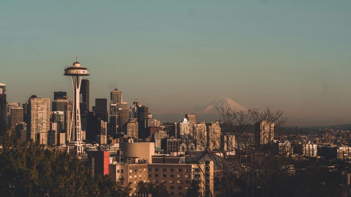 Stunning view of Seattle's skyline featuring the Space Needle with Mount Rainier in the background.