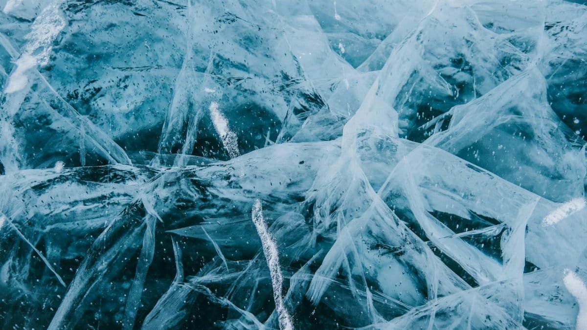 Detailed view of cracked ice patterns in Siberia showcasing intricate frozen structures.
