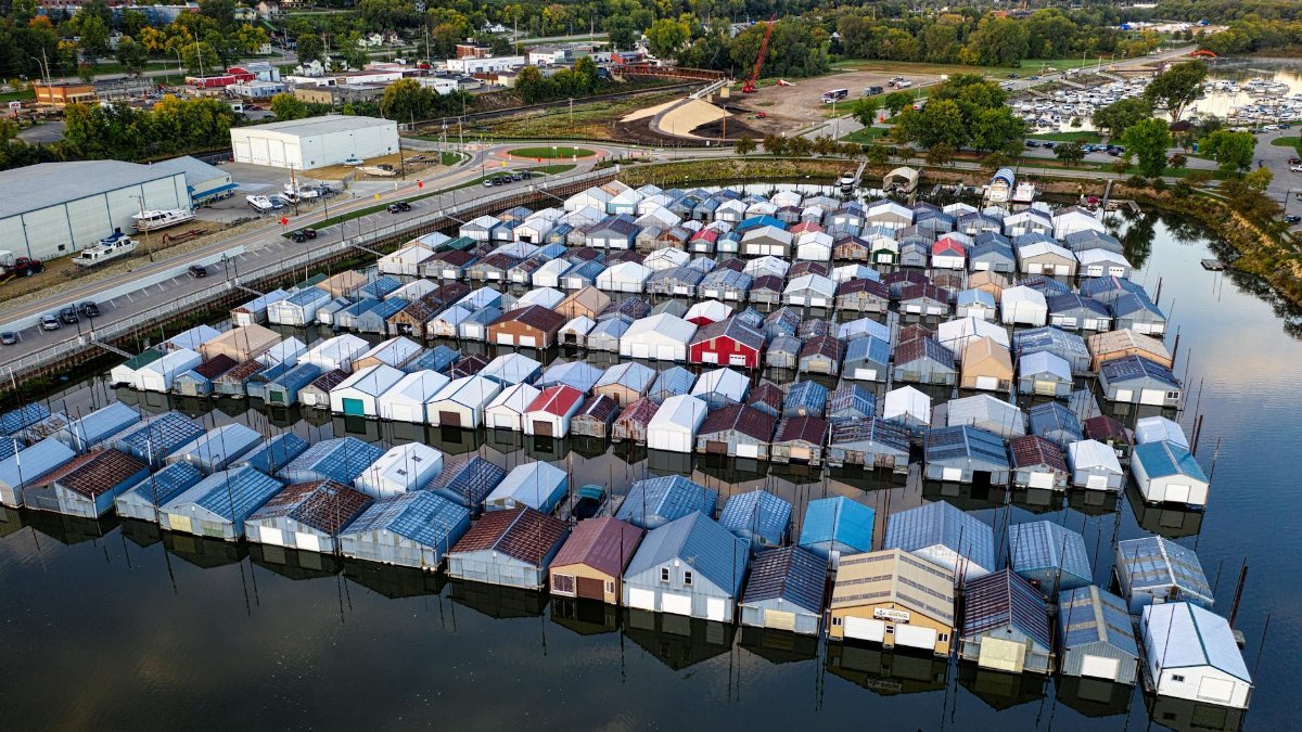 Aerial view of a marina with houseboats on a calm lake in Red Wing, Minnesota.