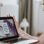 Woman engaging in an online manifestation course, focused and inspired.