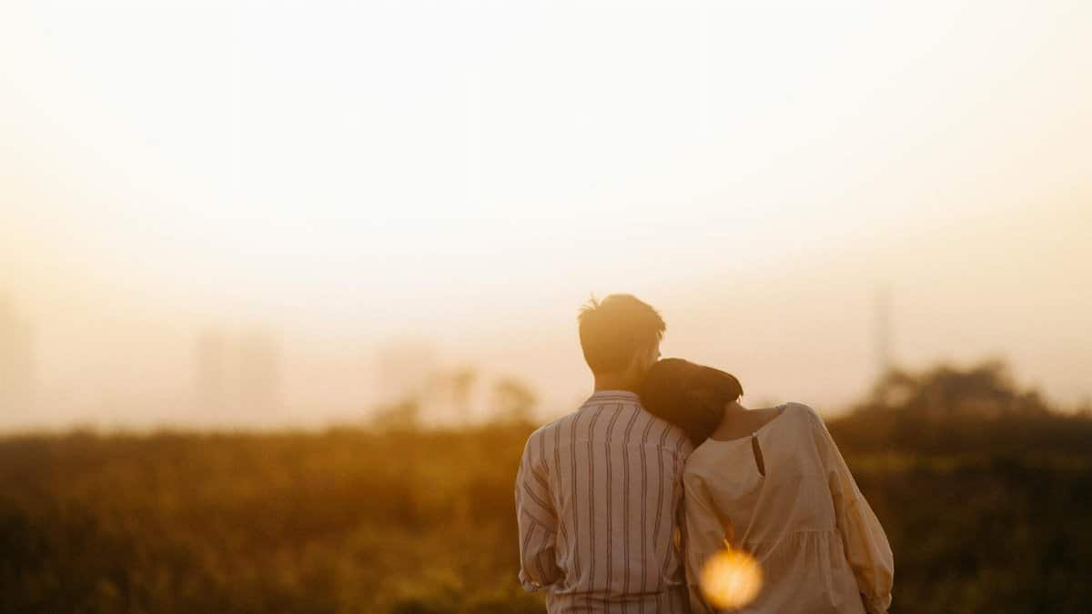 A couple enjoys a serene moment together during a sunset in Gia Lai, Vietnam.