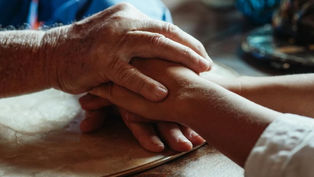 Close-up of supportive hands showing love and care. Ideal for themes of empathy and bonding.