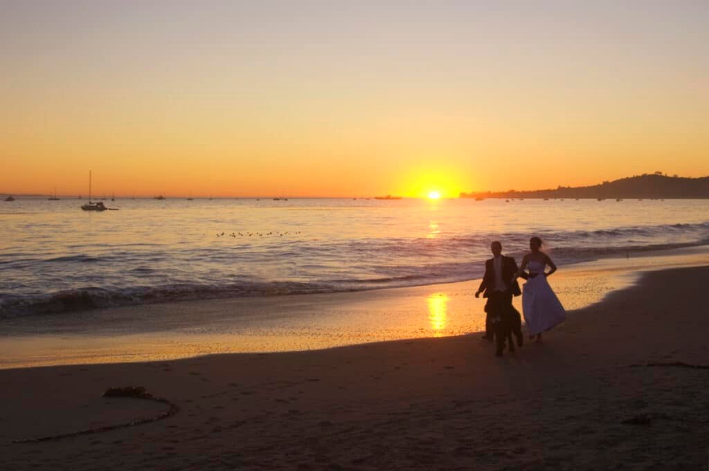 By Artem Beliaikin from Moscow, Russia - Happy young honeymoon couple having fun on the beach. Ocean, tropical vacation on Bali island, Indonesia., CC BY 2.0, https://commons.wikimedia.org/w/index.php?curid=105333228