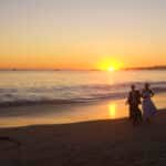 By Artem Beliaikin from Moscow, Russia - Happy young honeymoon couple having fun on the beach. Ocean, tropical vacation on Bali island, Indonesia., CC BY 2.0, https://commons.wikimedia.org/w/index.php?curid=105333228