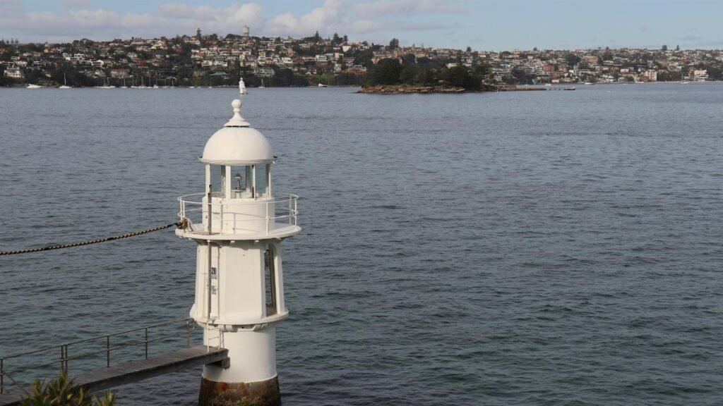 Picturesque view of Bradley's Head lighthouse overlooking Sydney Harbour.