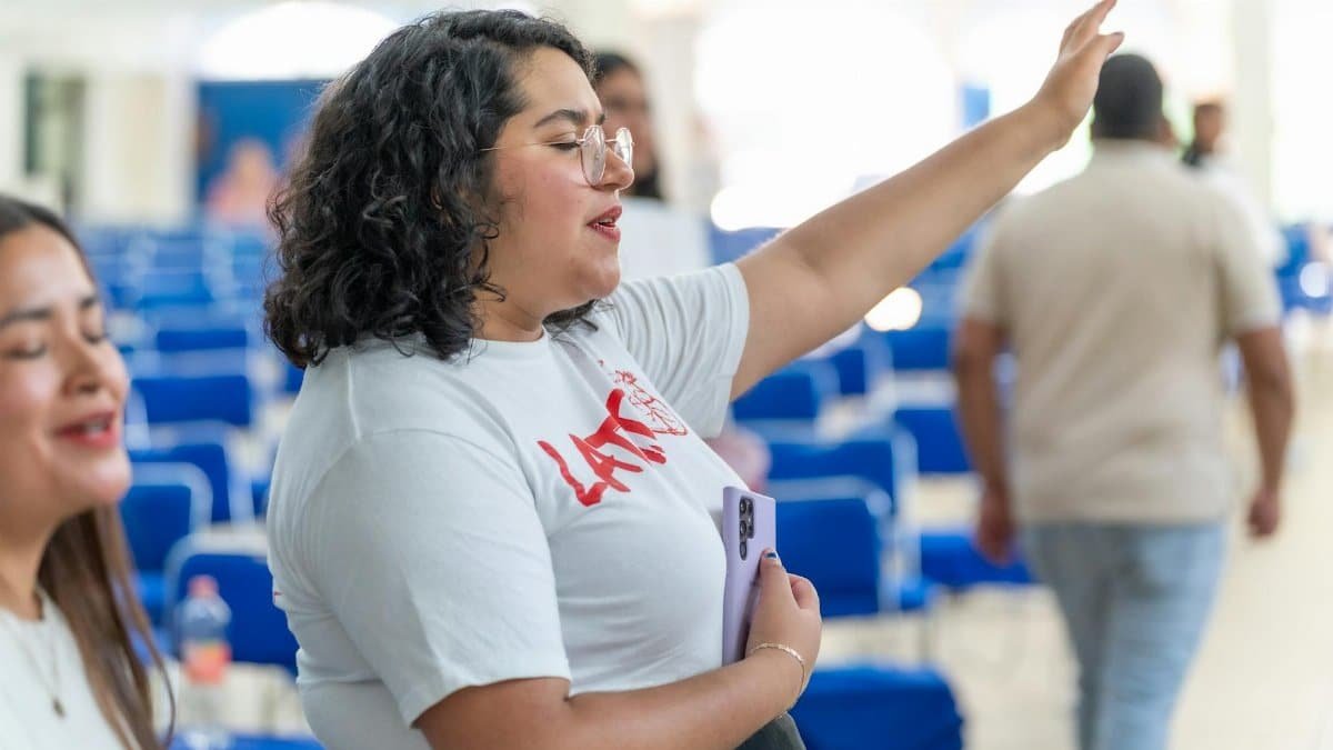 A woman passionately prays at a church gathering in Mexico City.