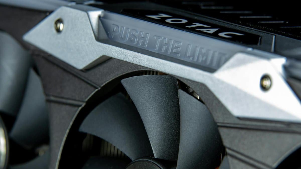 Detailed image of a graphics card with metal cooling fans and branding.