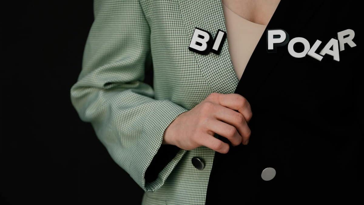 Image illustrating bipolar disorder concept with text on a dual-tone jacket.