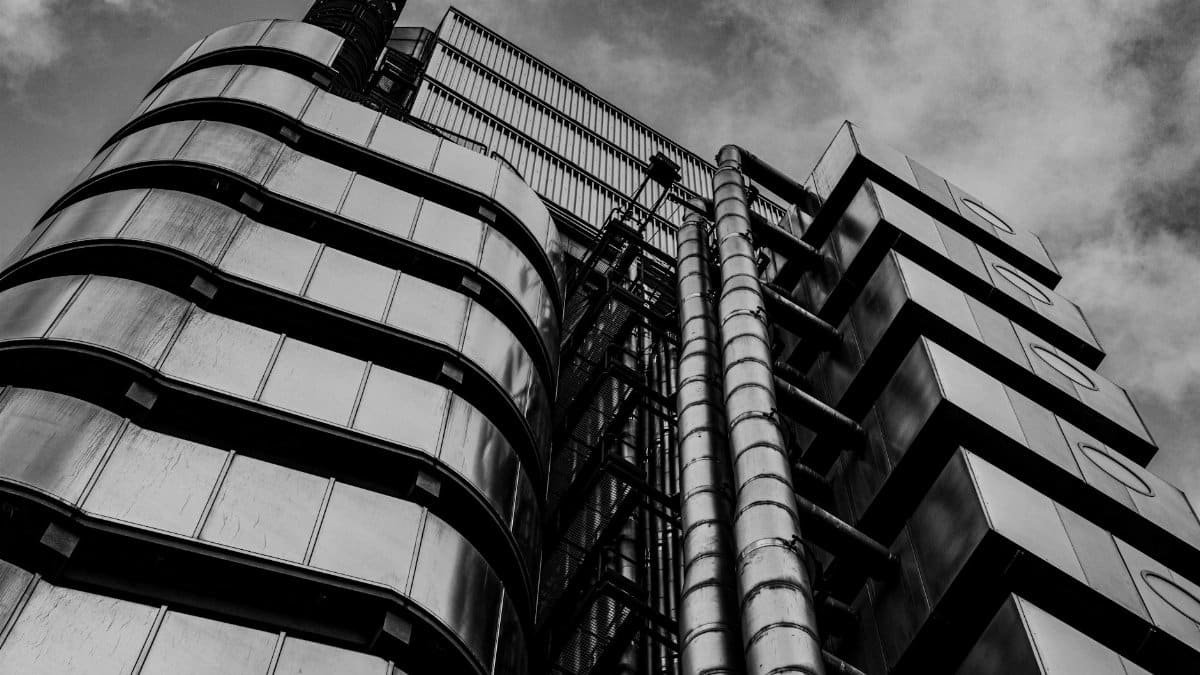 Black and white view of the iconic Lloyd's Building showcasing modern architecture in London, England.