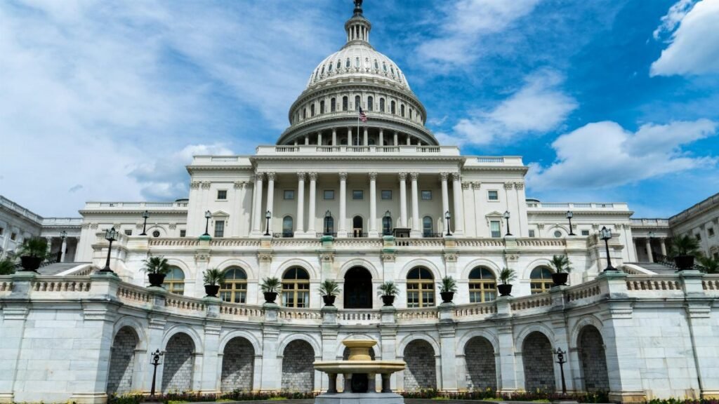 Exterior view of the iconic US Capitol Building on a sunny day in Washington, DC.