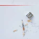 Spiral notebook with pencils, sharpener, and 'Stop burnout' written on paper.