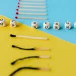 Visual depiction of burnout prevention using dice and matchsticks on colorful surfaces.