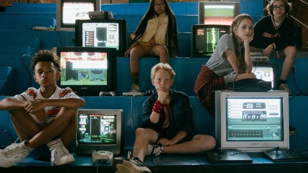 Group of teenagers enjoying retro video games with vintage monitors in an arcade setting.