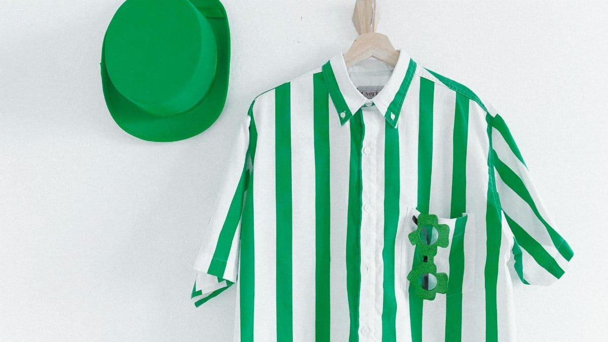 Bright green and white striped shirt with a matching green hat, perfect for themed celebrations.