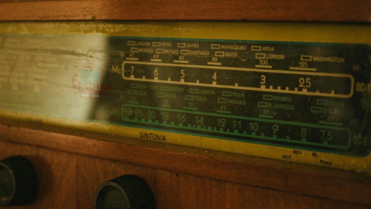 Close-up of a vintage radio tuner displaying frequency dials.
