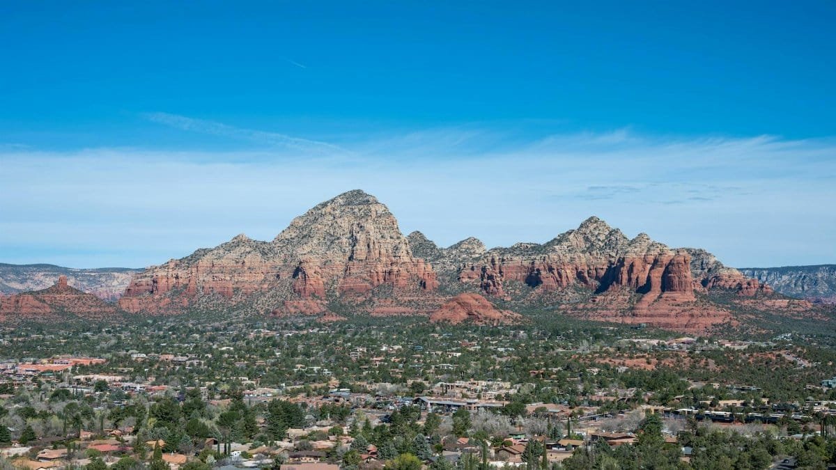 Scenic view of Sedona's stunning red rock formations under a clear blue sky.