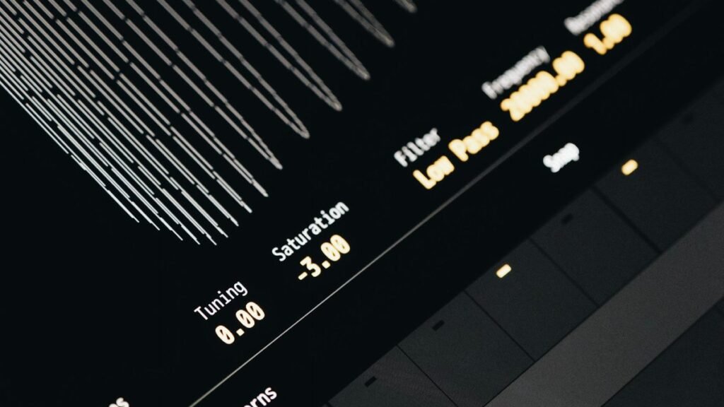 Close-up of a modern digital sound interface screen displaying tuning, saturation, and filter settings.