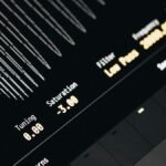 Close-up of a modern digital sound interface screen displaying tuning, saturation, and filter settings.