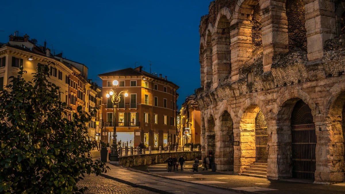 Stunning view of Verona Arena and surrounding architecture at dusk, showcasing Italian urban beauty.